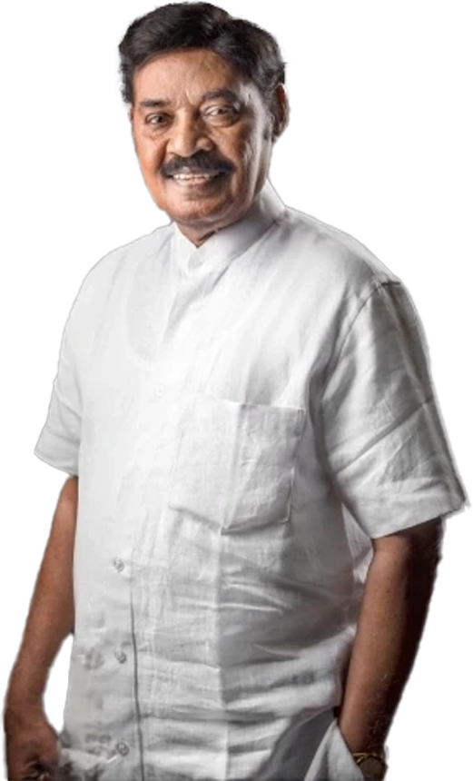 Dr. T. R. Paarivendhar standing and smiling, dressed in a white linen shirt